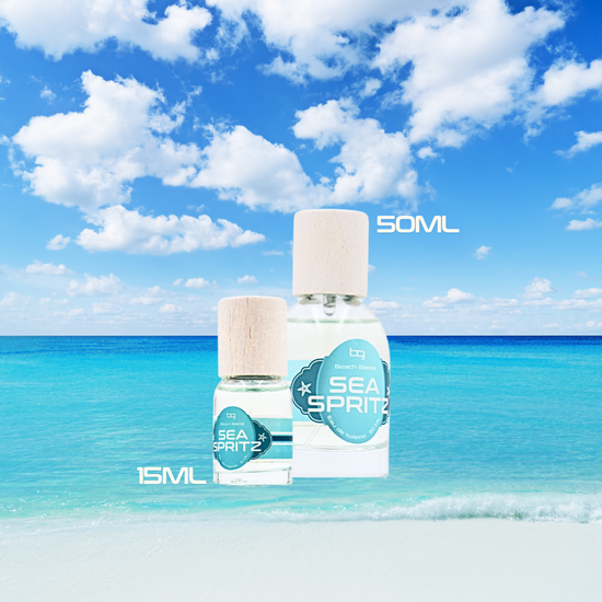 Two bottles of 'Sea Spritz' with size labels against a beach background