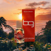 Beach Geeza Coco Moon perfume bottle and packaging with a sunset beach background