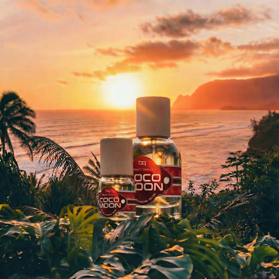 Two bottles of COCO MOON products on a tropical background with a sunset.