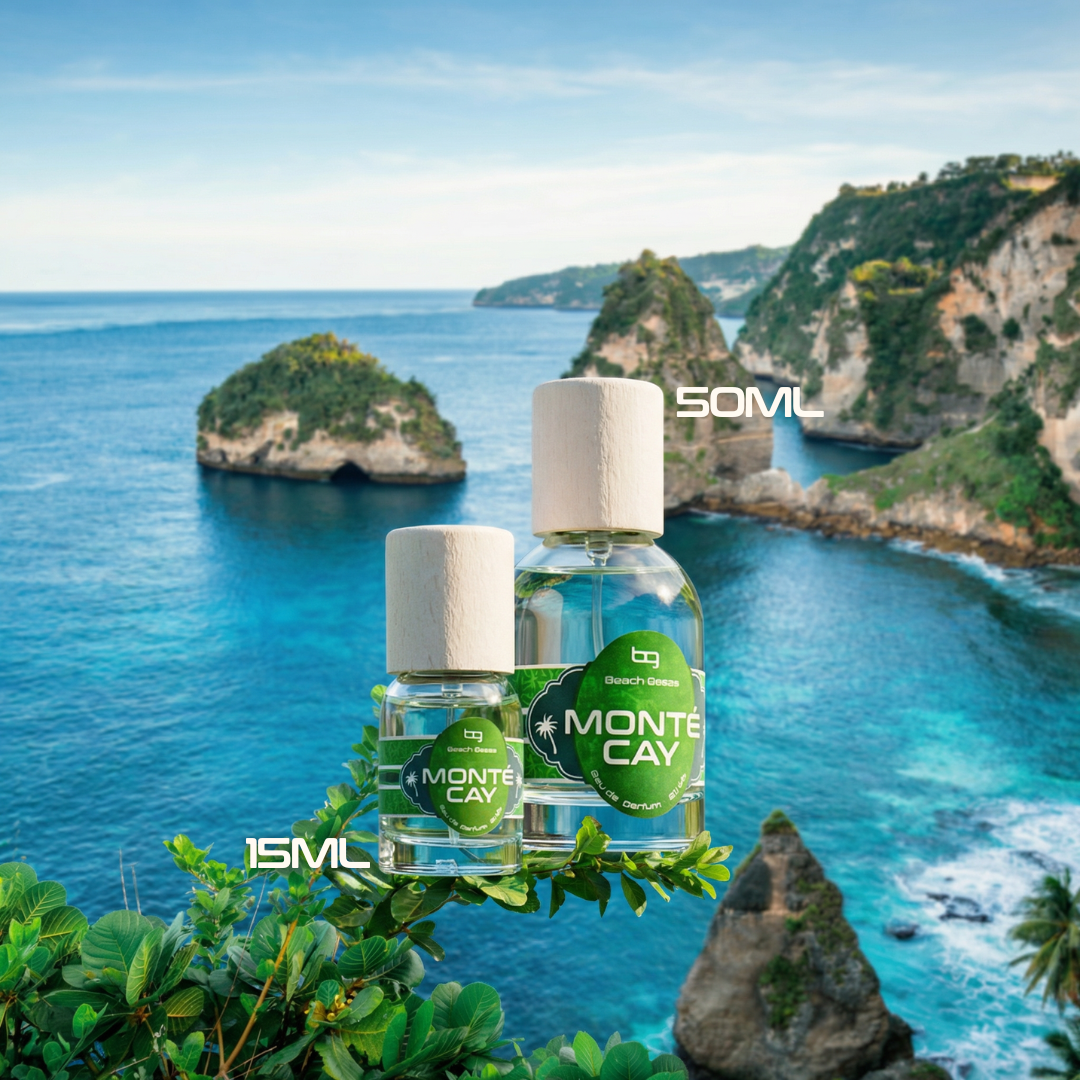 Two bottles of Monte Cay perfume with a scenic ocean view in the background